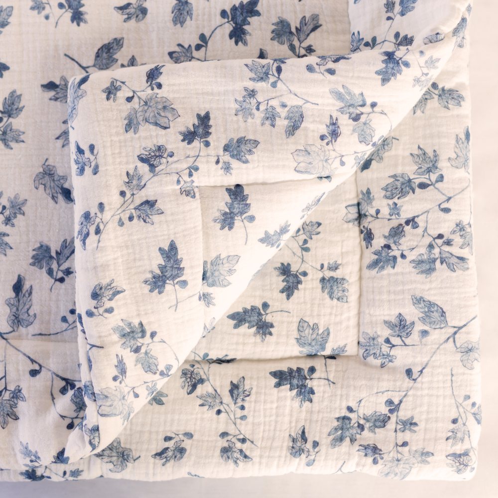 Fig muslin playmat from above with one corner turned back