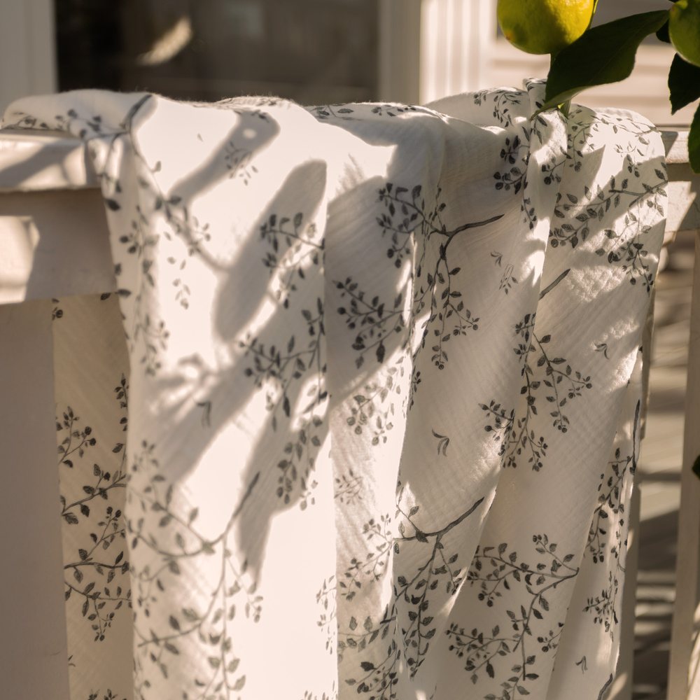 Snowberry muslin over a verandah rail beside a lemon tree