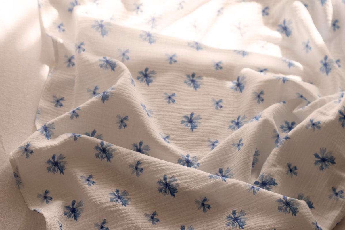 Fig and Cornflower muslin in a woven basket